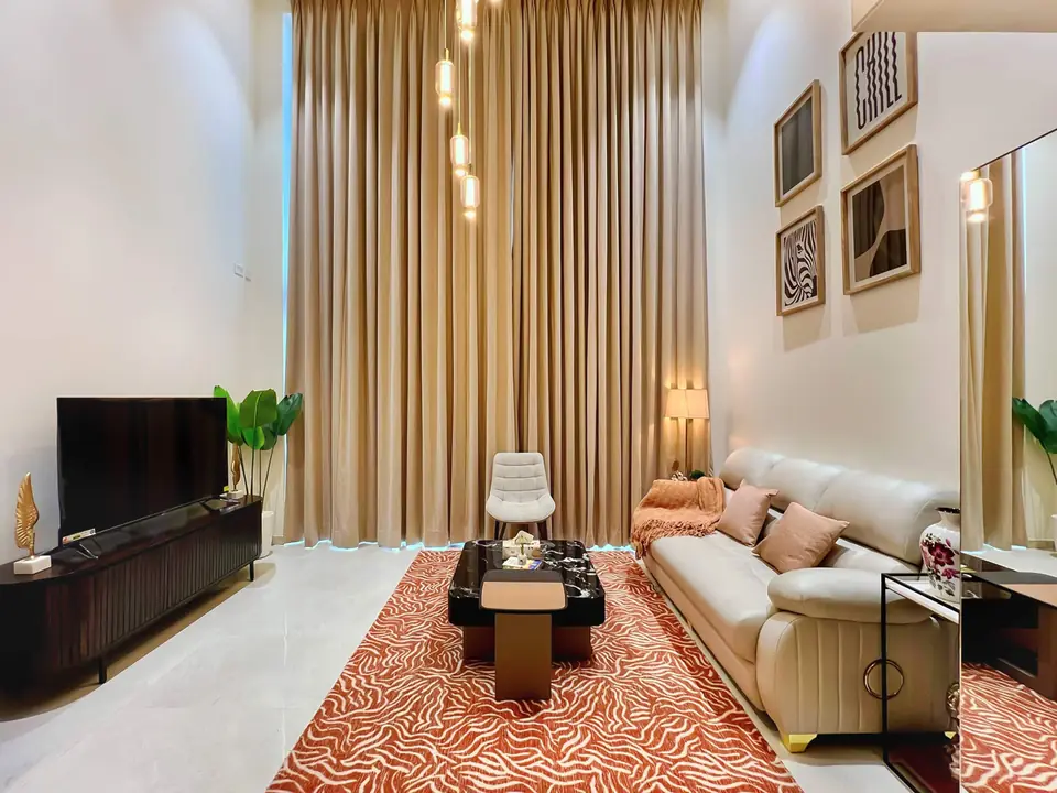 Living room with TV unit and lounge chair