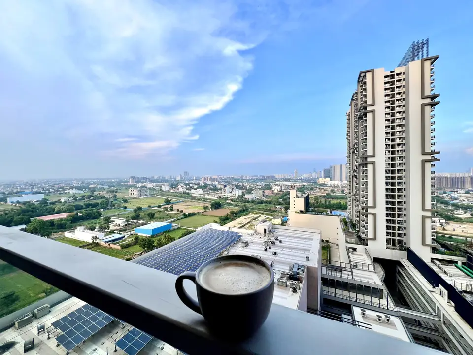 Coffee on the balcony with city view