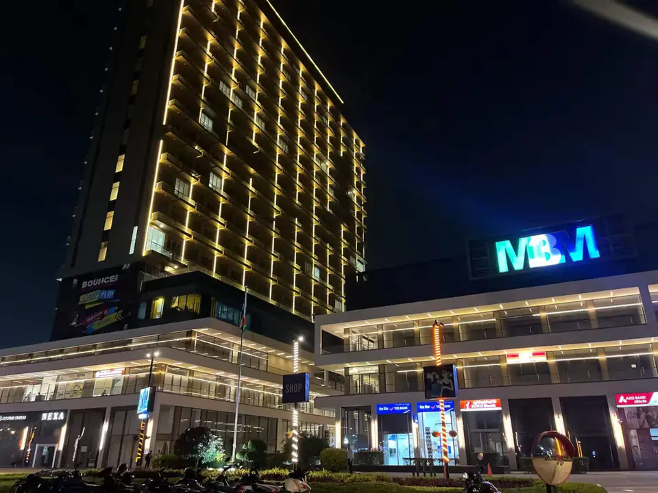 M3M Cornerwalk lit up at night